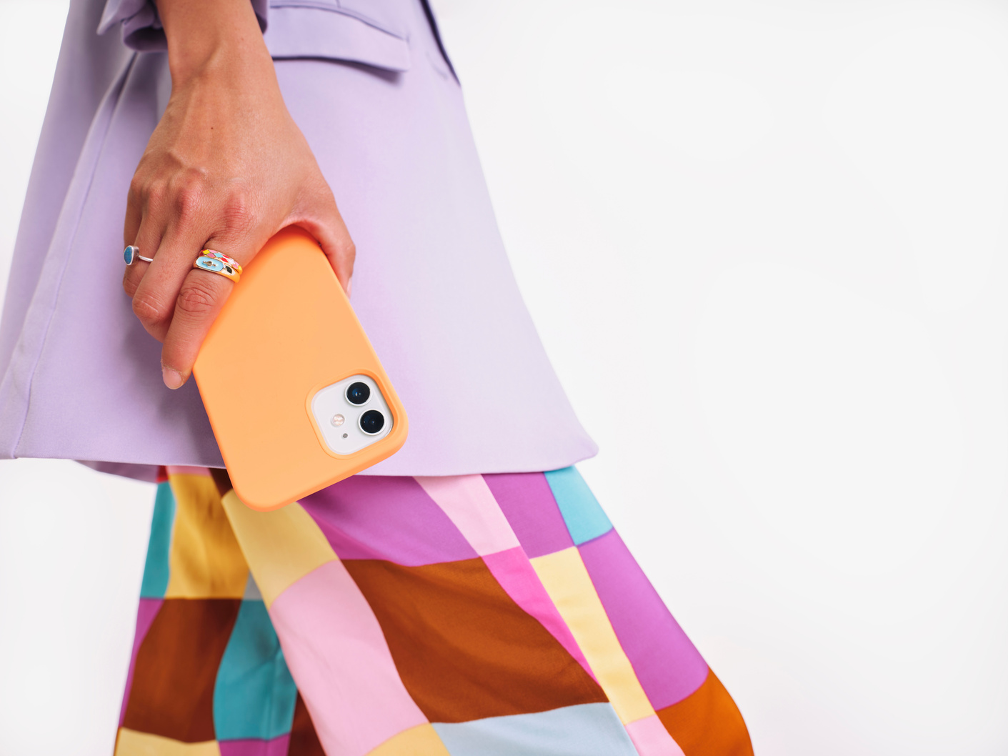 Modern Fintech Person in Colorful Outfit Holding Smartphone