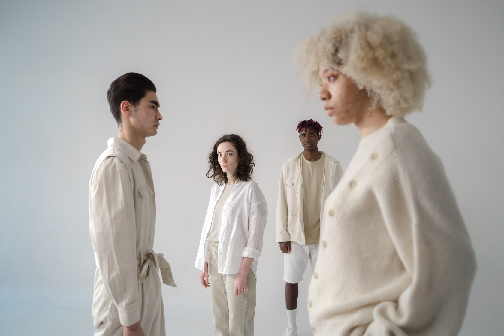 Photo of Men and Women in Stylish Clothes