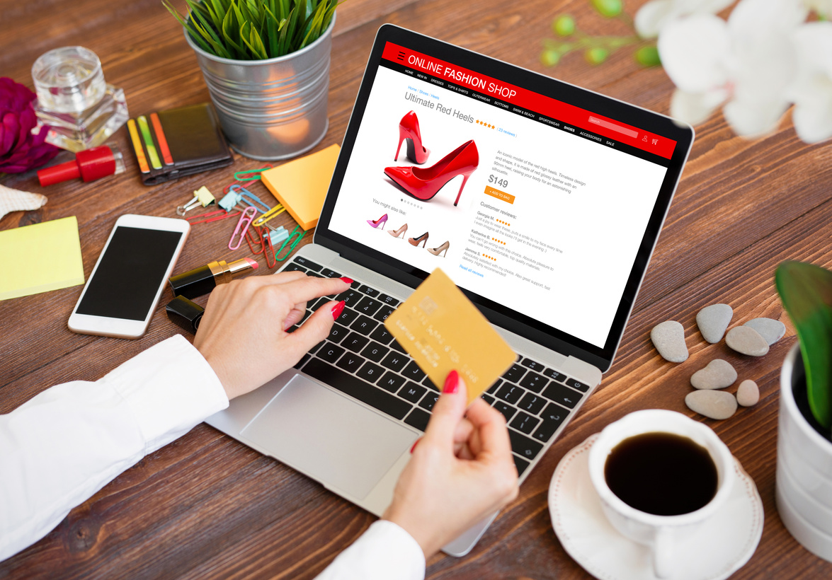 Person Shopping Shoes Online with Credit Card