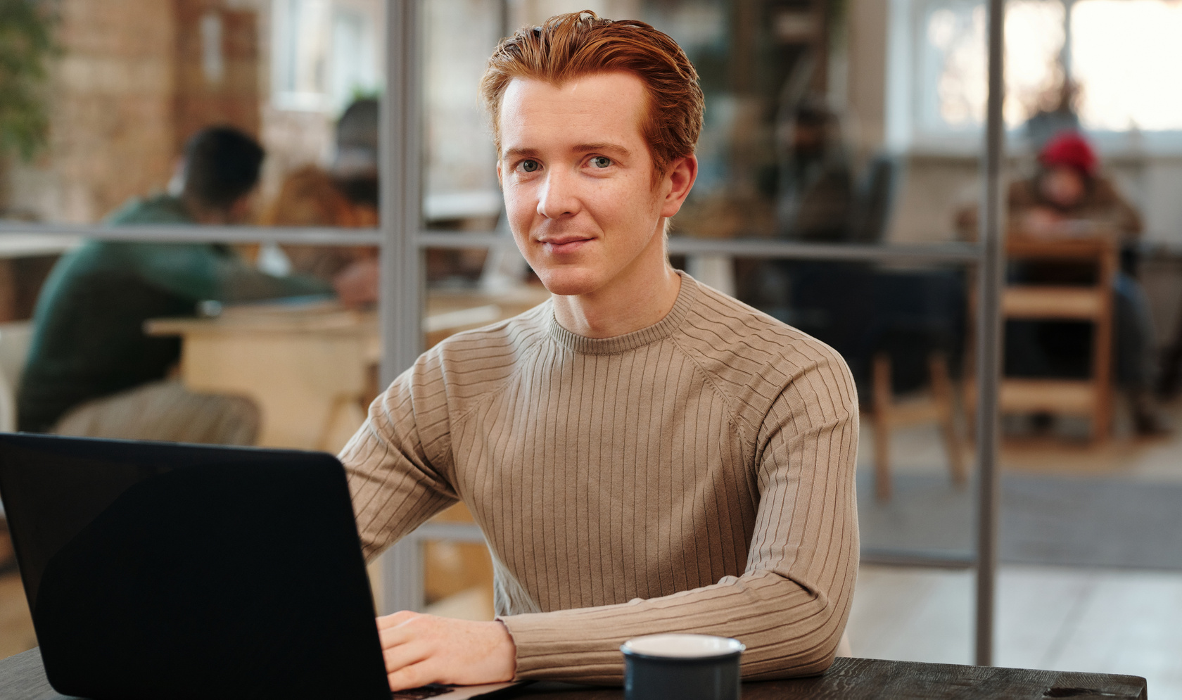 Photo of a Man in Brown Sweater